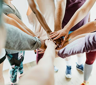 Students Teamwork Hands Together