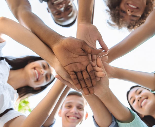 Students Teamwork Hands Together School