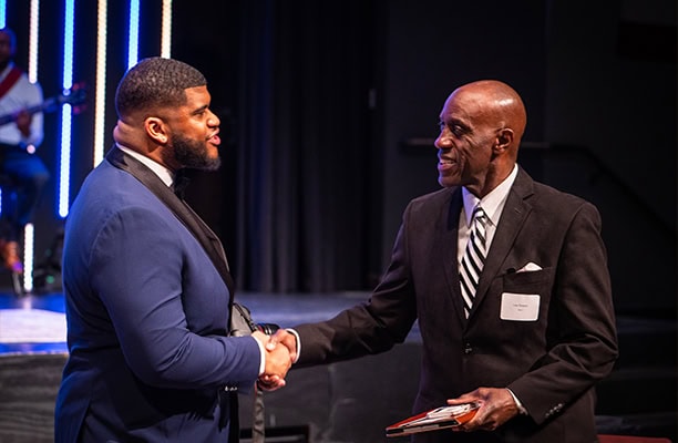 Heart Of A Champion Gala Handshake On Stage